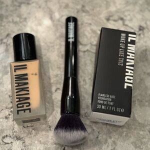 Two bottles of Il Makiage foundation and one foundation brush.